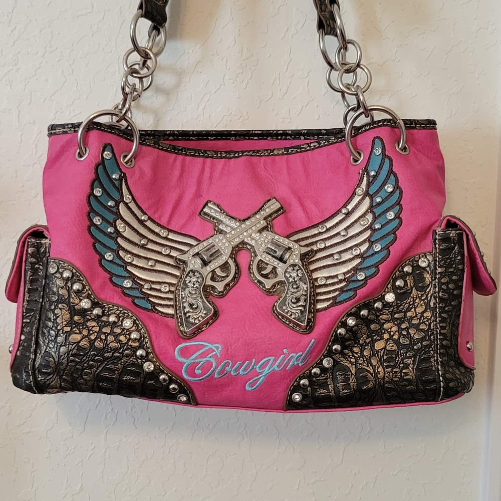 Cowgirl six shooter hot pink blingy purse.